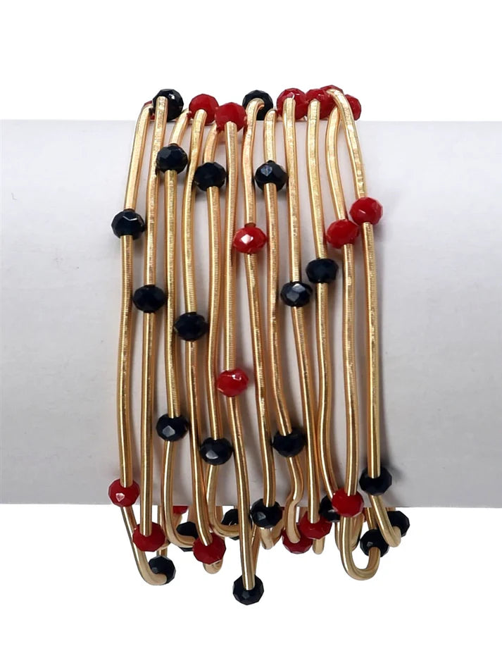 Black, red and gold stackable bracelets. Red and Black beads with gold tubing in between each bead.